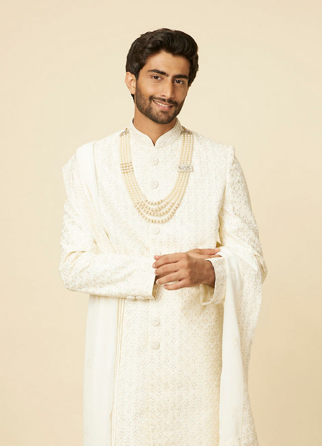 alt message - Manyavar Men Warm White Sequined Sherwani Set image number 0